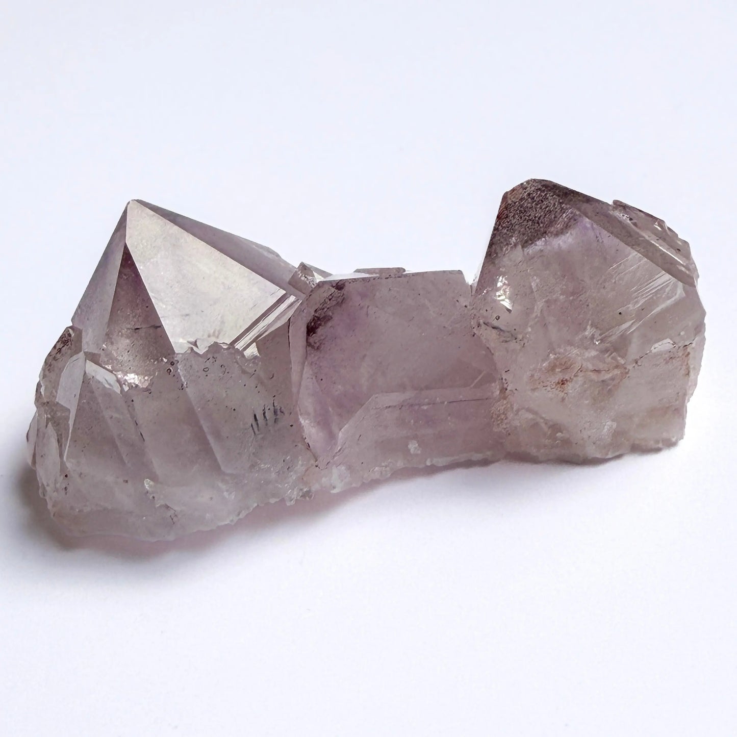 Amethyst Crystal formation on a white background