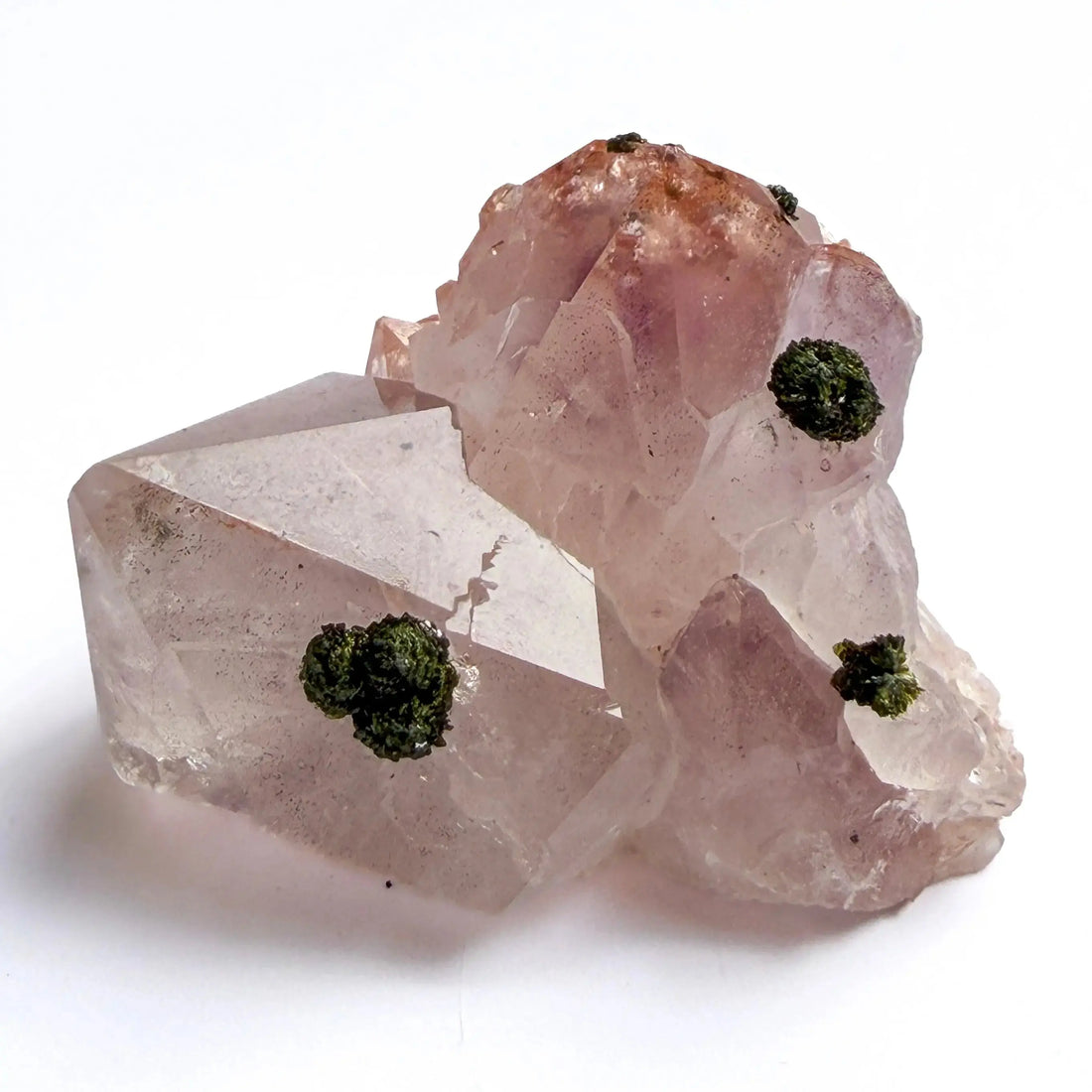 pink amethyst with epidote gemstone inclusion on a white background