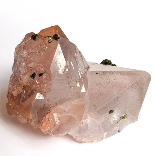 red inclusion of a clear crystal and green epidote gemstone inclusion