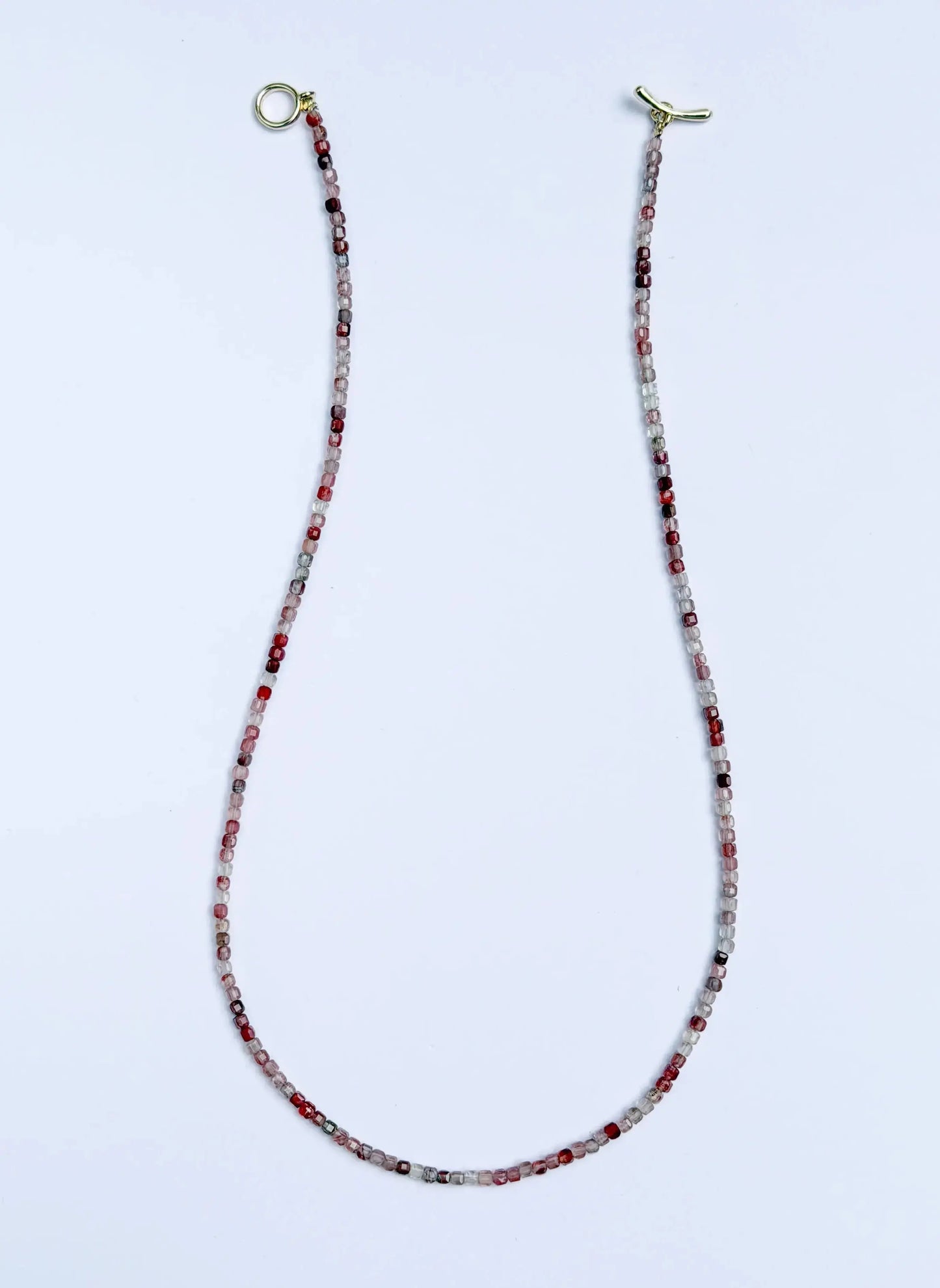 Andesine Beaded eyeglass chain with gold ends on a white background