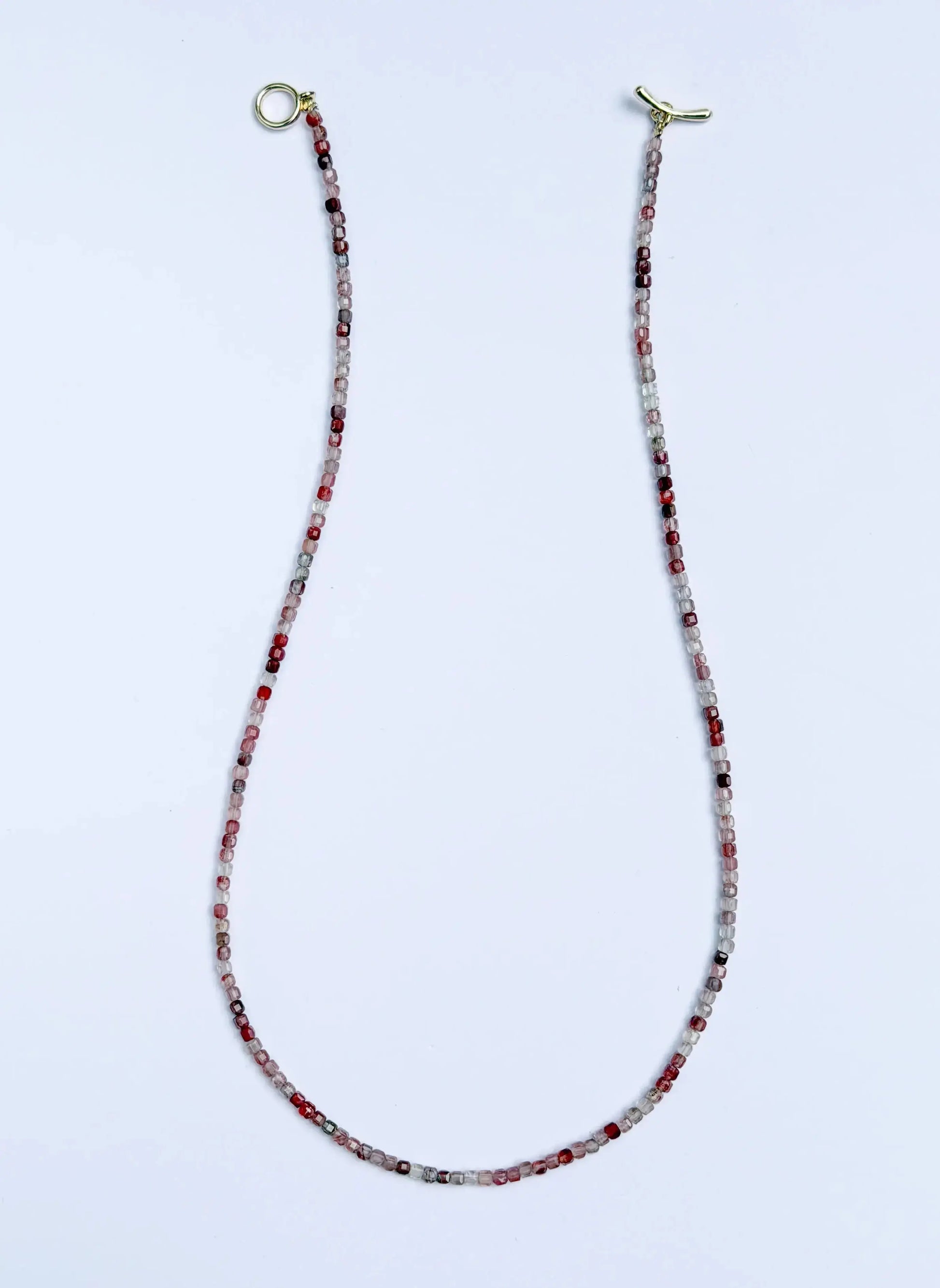 Andesine Beaded eyeglass chain with gold ends on a white background