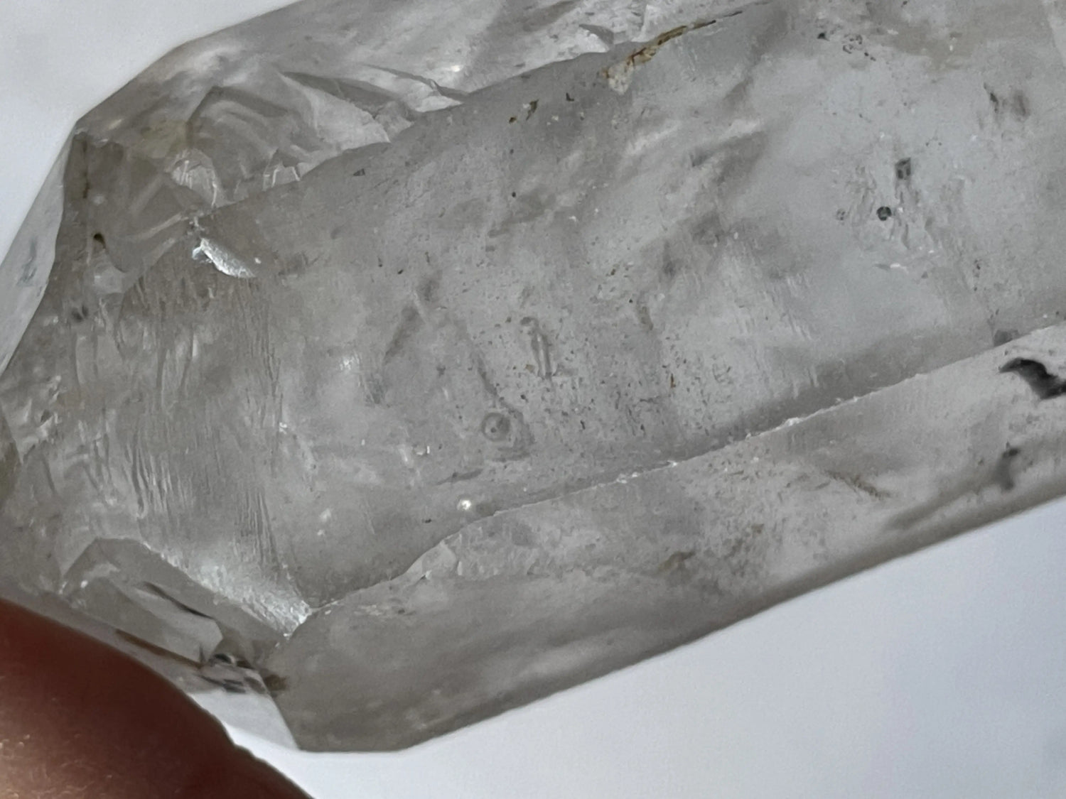Natural enhydro crystal with visible moving water bubble inside clear quartz