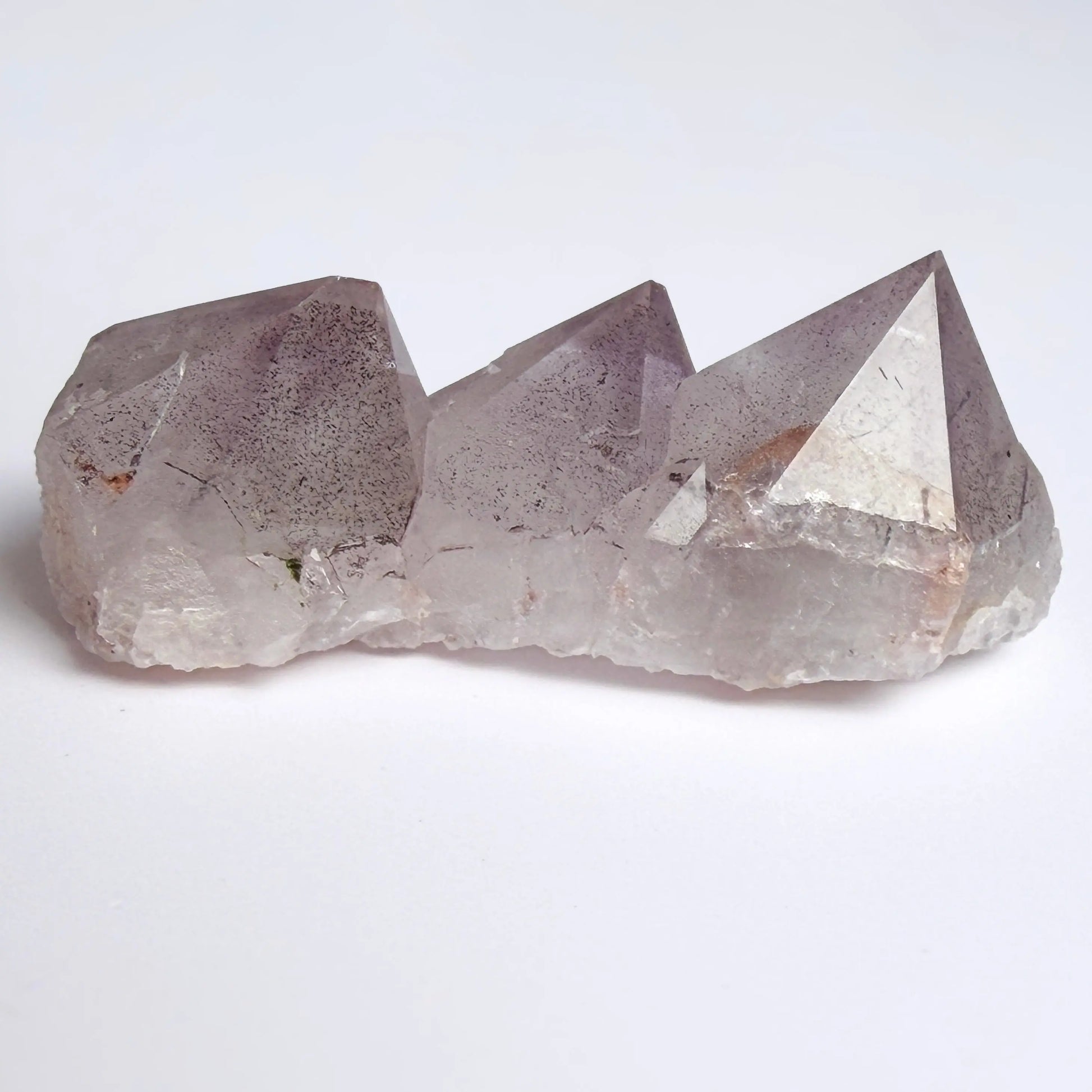 Amethyst Crystal with geometric shape on a white background