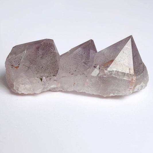 Amethyst Crystal with geometric shape on a white background