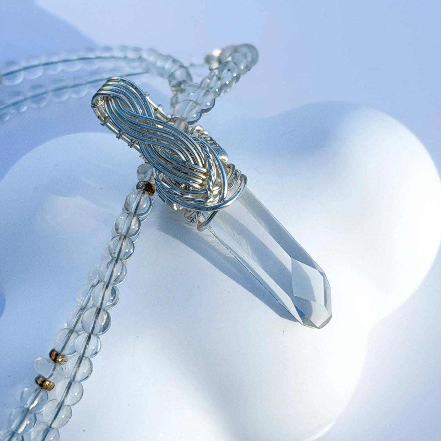 Crystal pendant necklace on a white background