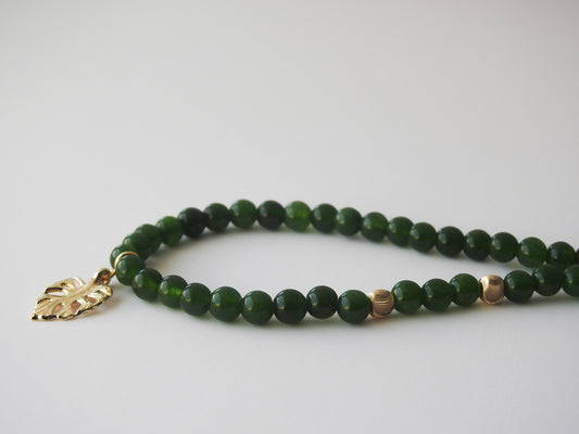 "Jade Tropic" – Green Jade Beaded Necklace with Gold Monstera Leaf Pendant