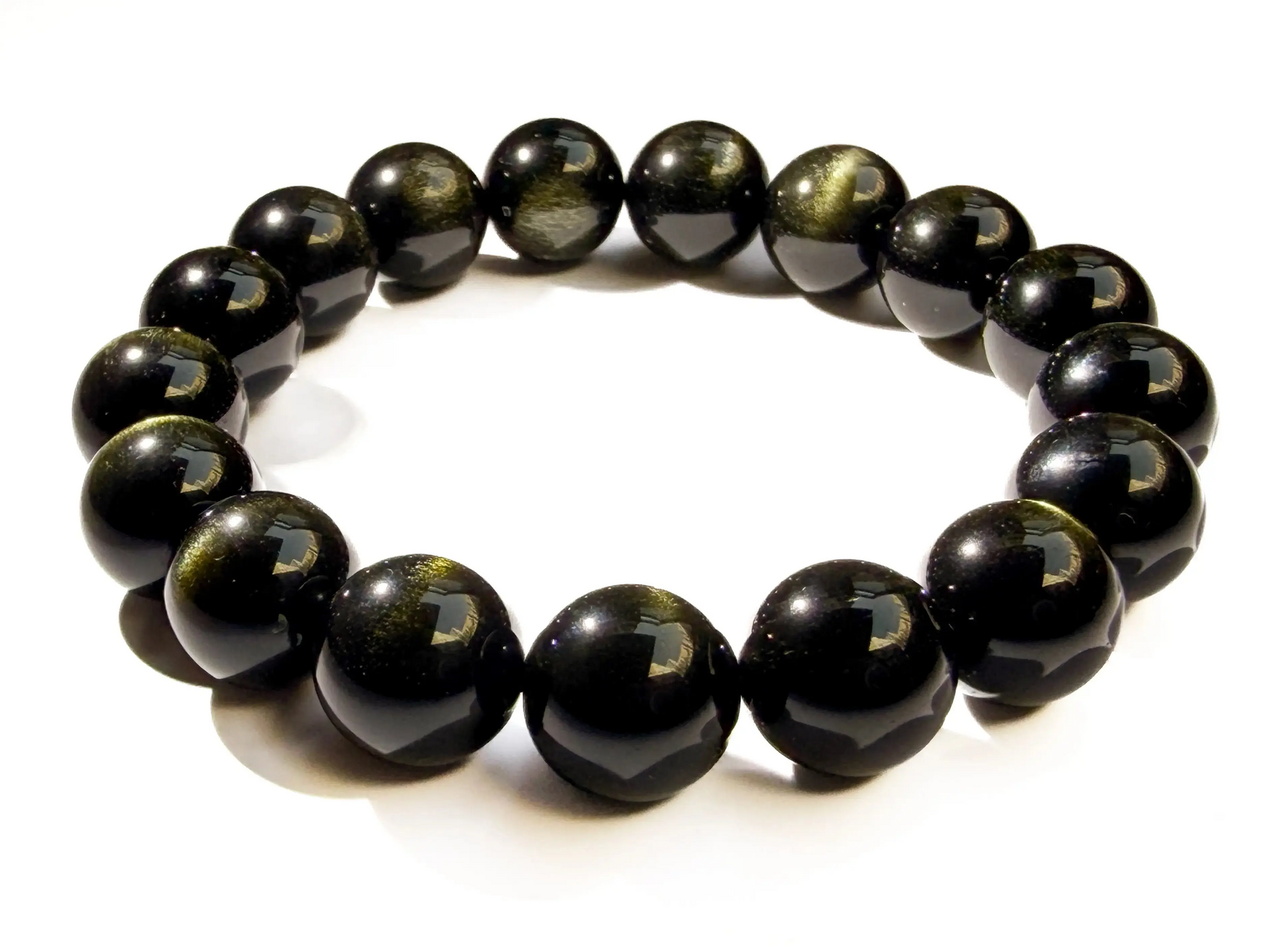 gold sheen obsidian bracelet on white desk