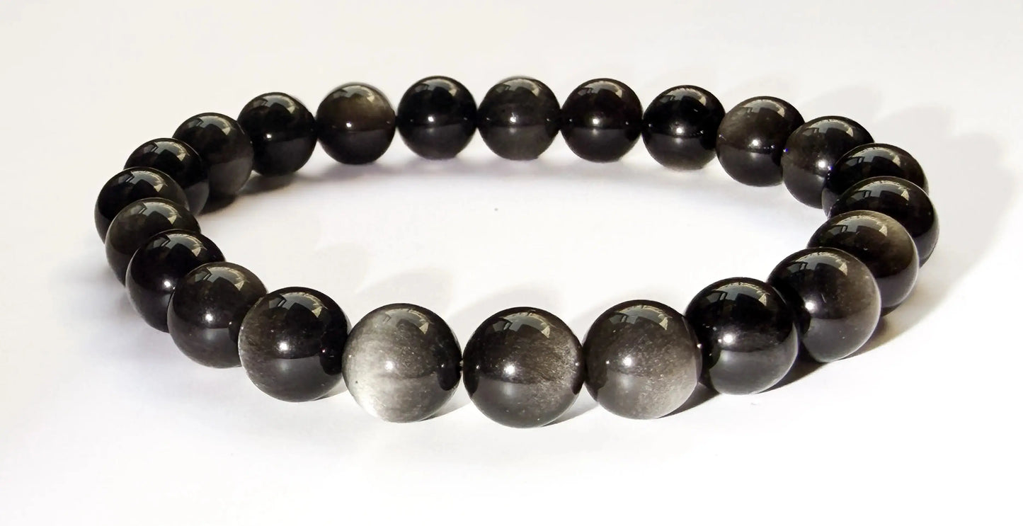 silver sheen obsidian bracelet on white desk
