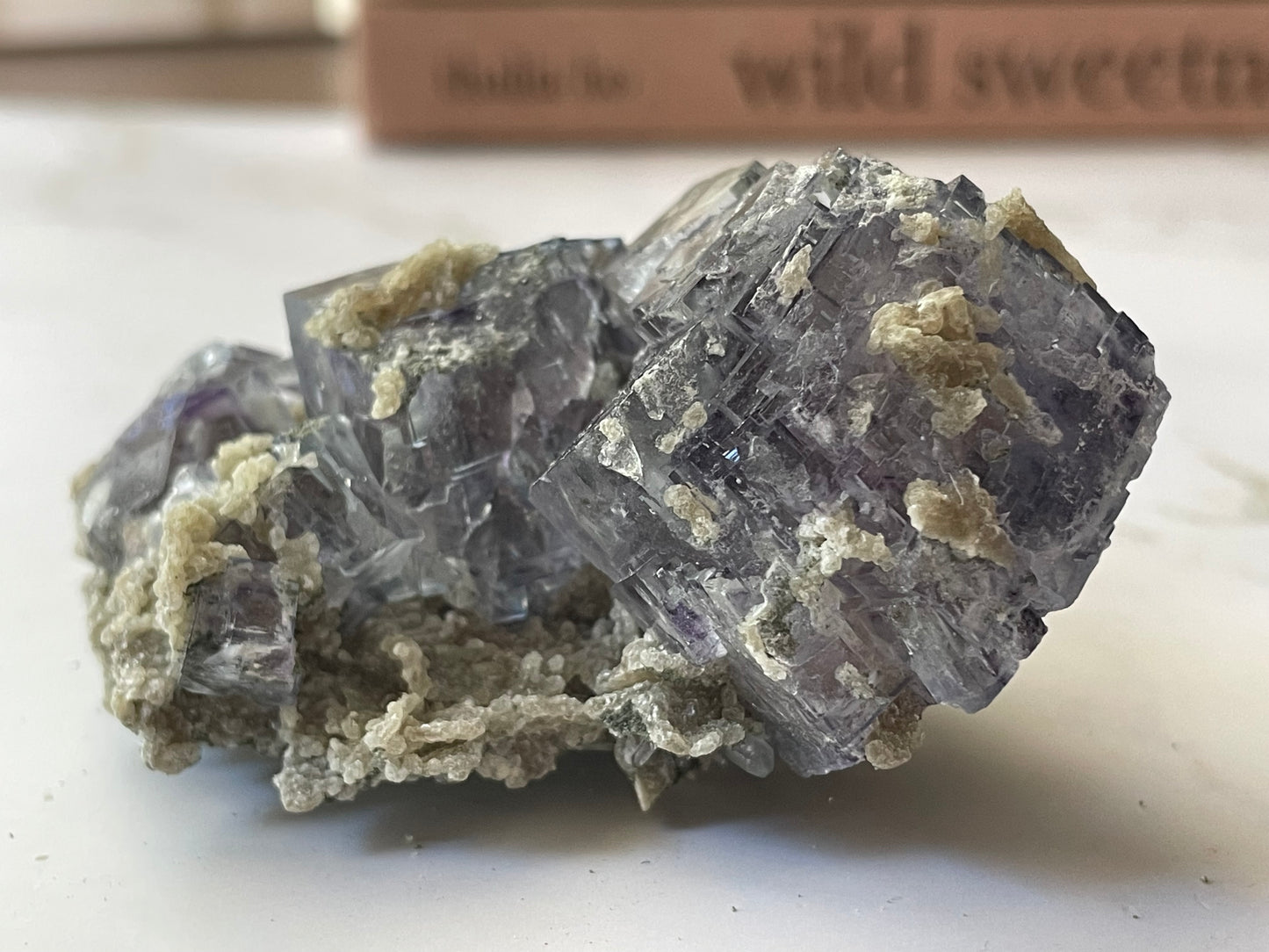 Vivid purple cubic fluorite crystal specimen from Yaogangxian Mine, Hunan China — front view showing gem-quality transparency