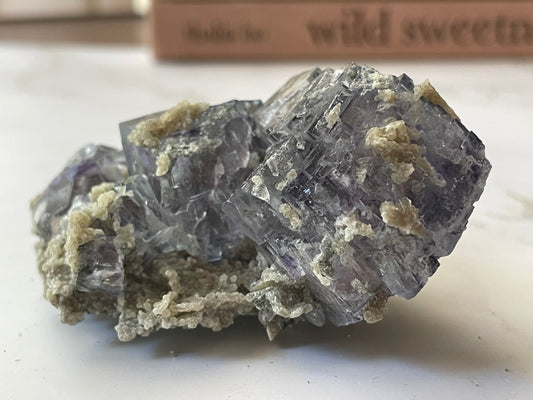 Vivid purple cubic fluorite crystal specimen from Yaogangxian Mine, Hunan China — front view showing gem-quality transparency