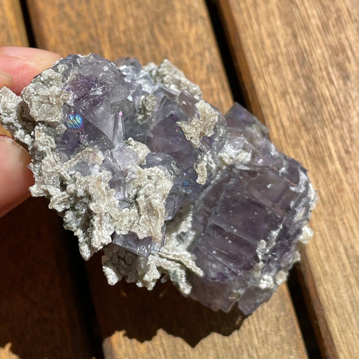 Purple fluorite cube side profile showing crystal depth and natural matrix base — Yaogangxian Mine, China