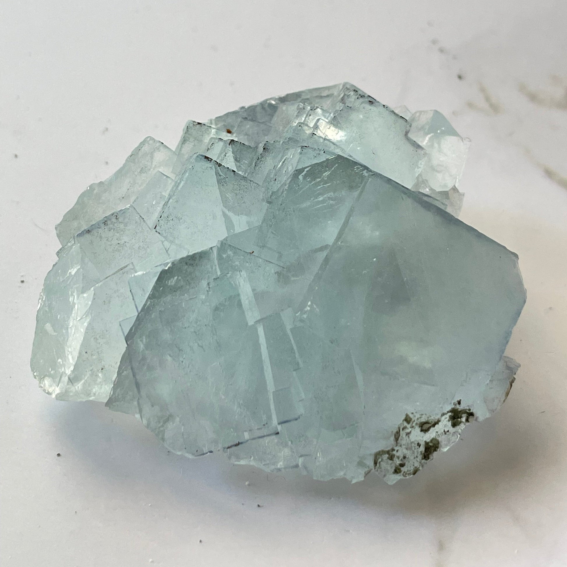 Pale blue cubic fluorite crystal from Yaogangxian Mine, China — soft jewel-toned color with transparent crystal edges