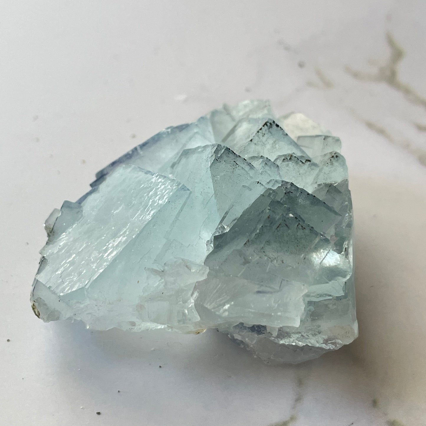 Gem-quality baby blue fluorite specimen from Yaogangxian Mine, Hunan China — front view showing cubic crystal faces and gem transparency