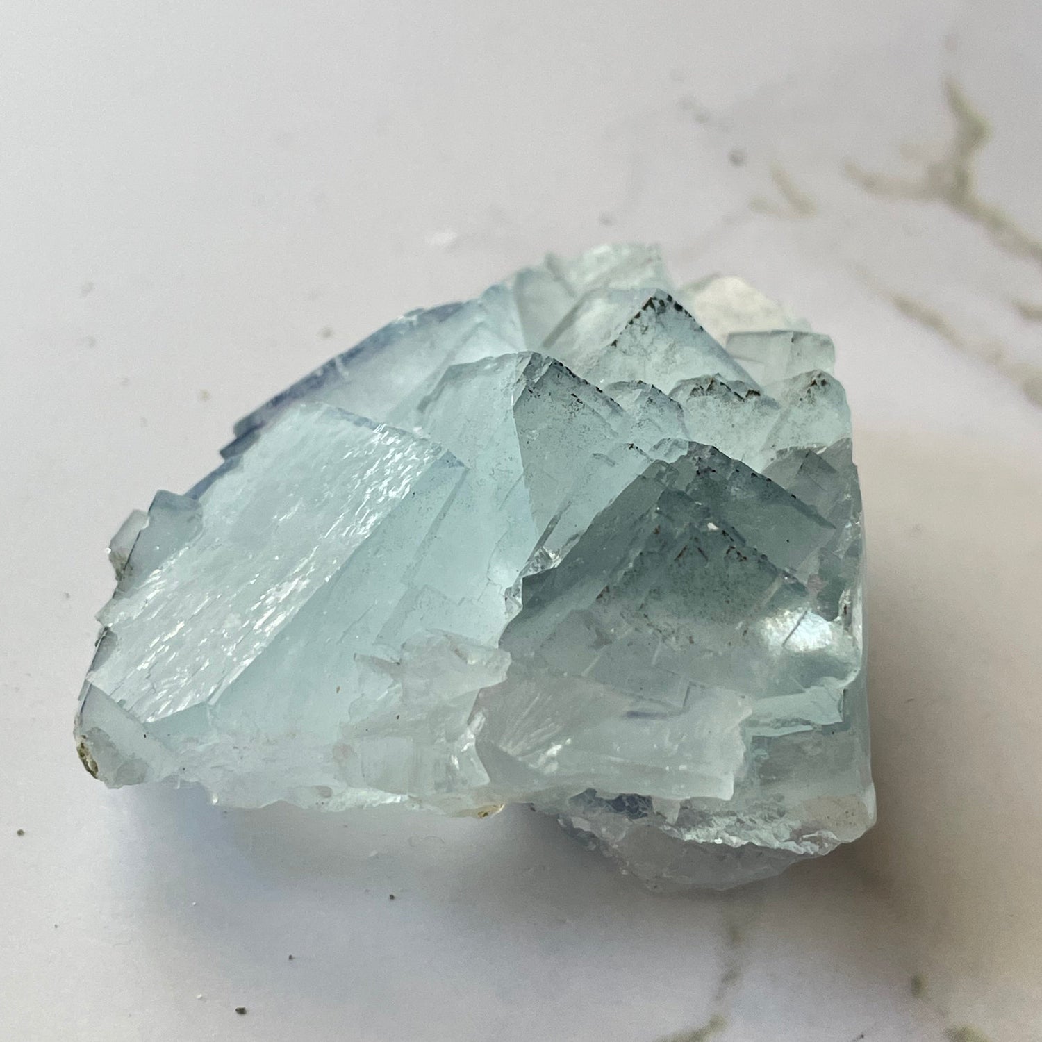 Gem-quality baby blue fluorite specimen from Yaogangxian Mine, Hunan China — front view showing cubic crystal faces and gem transparency